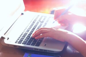 comparing wix vs wordpress on a laptop for a small business website